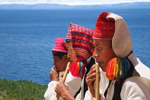 Music man playing at Taquile island in Titicaca lake