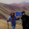 Tourists standing on Rainbow Mountain in Peru